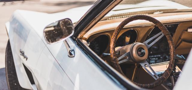 Vintage white car with tan interior